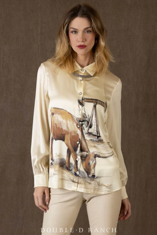 UPSCALE APPEAL WITH STRONG WESTERN ROOTS.
This beautiful blouse is bound to be a fan favorite from Midland to Mount Pleasant (and all over the country, of course). It’s a sleek silk emblazoned with a distinctly Western oil field scene – complete with a regal steed – crafted in a chic silhouette and finished with askew squared pearl snaps. It’s got an heir of elegance and old money and it’s going to be a lot more versatile than you might think!

color: bone
content: 95% silk, 5% elastane
embellishments: custom print, snap closure
fit: relaxed fit, length below hip
T4242
collection: Roughneck Rodeo
In stock