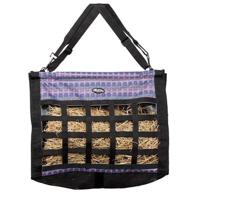 Weaver Slow Feed Hay Bag are top loading, constructed of durable 600 denier polyester with a mesh bottom for ventilation and two adjustable detachable straps for easy transportation and hanging options. Slow feed hay bags help to alleviate boredom, promote healthy digestion, reduce waste and are great for use in stalls or trailers.   Shop Affordable and Best Price Trailer and Barn Supplies and Hay Feeders at Pilot Point Feed Store!