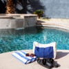 A Multi-Pocket Organic Cotton Tote Bag next to a pool