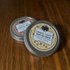 Two heal-all balms in aluminum twist tins in patchouli rose or lemongrass lavender scents