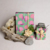 Multiple gifts wrapped in compostable and reversible mushroom and snails wrapping paper