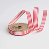 A cardboard spool of red and white striped 100% cotton curling ribbon