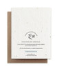The plain back of a vertical plantable card with company information and kraft envelope on a blank white background