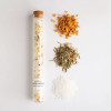 Natural grapefruit lemongrass bath soak in a glass vial with cork closure