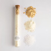 Natural milk + honey bath soak in a glass vial with cork closure
