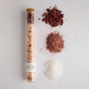 Natural rose sandalwood bath soak in a glass vial with cork closure