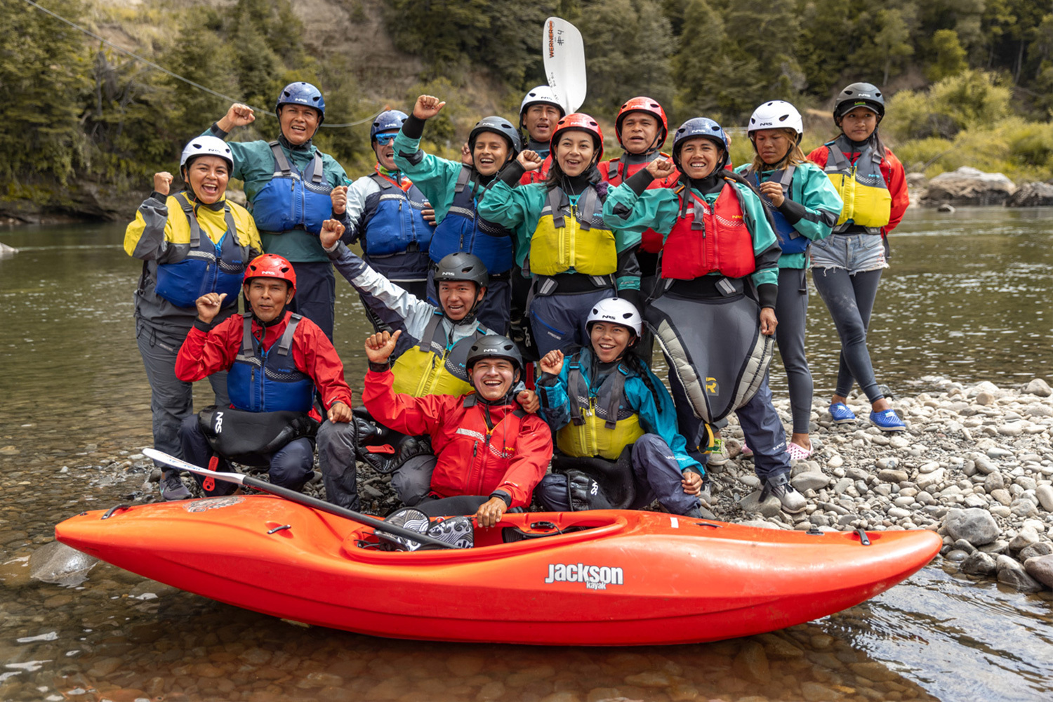instructor with a young paddler in a Jackson Kayak