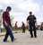 Performing a one legged-stand test which is a field sobriety test while wearing a Drunk Busters Impairment Goggle.
