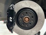 Vagbremtechnic Front Brake Kit - 4 Piston Brembo Caliper - 340x30mm OE 1 Piece Discs - PQ35 / MQB - Gloss Black with White 'R' Logo