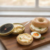 Salmon roe butter spread on a toasted bagel with cream cheese