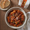Baked Mancini Tuffoli stuffed with cheese and ragú sauce