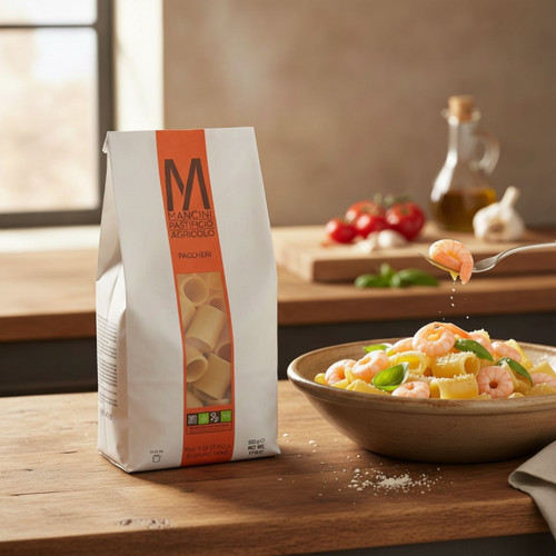 Cooked Mancini Paccheri plated with shrimp sauce