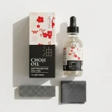 Tinyroots Japanese Choji Oil, a rust prevention solution specifically designed for the maintenance of bonsai tools. The image features the product's packaging: a rectangular cardboard box and a clear 1 fluid ounce (30ml) glass bottle equipped with a black rubber-topped glass dropper.