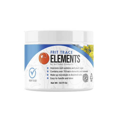 A white, cylindrical plastic jar of Frit Trace Elements by Ho Yoku Products, a specialty soil amendment for bonsai trees. The blue and white label features a distinctive orange logo with a stylized bird profile. Bold text identifies the product as "FRIT TRACE ELEMENTS," and bullet points list its benefits: improving root systems and plant vigor, containing over 70 trace elements and minerals, and waking up microbials in depleted soils. The 2 fl oz container also displays a "Ready to Use!" checkmark badge and a "Made in the USA" seal, set against a background of faint plant sketches and a small photo of yellow flowers.