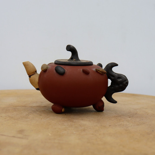 Handmade Yixing teapot with a rounded egg-shaped body in reddish clay, No. 3
