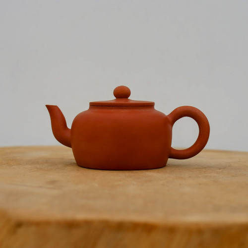 Handmade reddish-brown Yixing zisha teapot with a short curving spout, No. 4