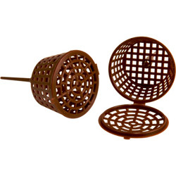 A close-up image of two dark brown, plastic bonsai fertilizer cups set against a clean white background. On the left, one cup is shown from a side profile, closed and lying horizontally, highlighting a long, integrated spike extending from its base for easy insertion into potting soil. To the right, another fertilizer cup stands upright with its hinged, circular lid open and resting on the surface. Each cup is constructed with a lattice or cage-like structure, featuring a square grid pattern on the sides and a concentric circular design on the top and bottom. This design is intended to hold fertilizer pellets securely while protecting them from birds and the elements, and allowing water to pass through for a controlled release of nutrients to the bonsai tree's root system.