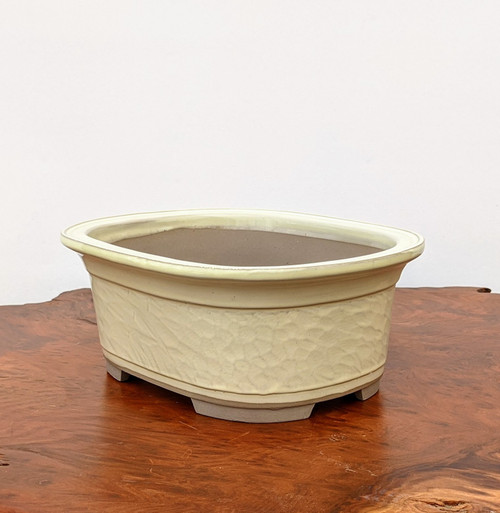 Rectangular cream glazed pot with rounded corners and a flat rim