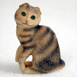 Miniature brown tabby Scottish Fold cat figurine with the breed's small folded ears