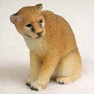 Miniature cougar figurine, also called a mountain lion, a decorative bonsai accessory