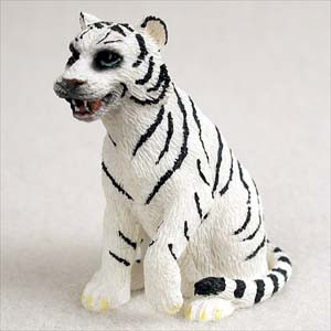 Miniature white tiger figurine sitting upright with its head turned, a bonsai accessory