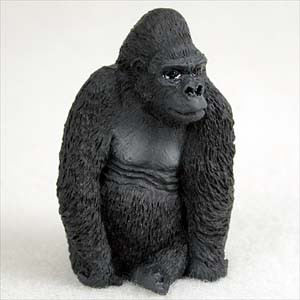 Miniature dark gray gorilla figurine in a calm seated pose, a bonsai accessory