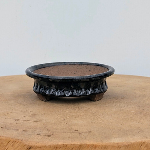 4 inch handmade bonsai pot by Brandon Besserer with a glossy black glaze and a rounded rim