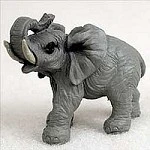 Miniature grey elephant figurine with its trunk raised, a decorative bonsai accessory