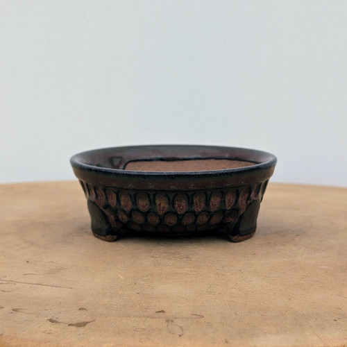 4 inch Brandon Besserer oval bonsai pot with a dark metallic glaze, No. 11