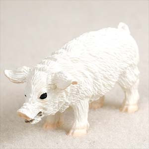 A side-profile close-up of a small, white pig figurine designed as a bonsai tree accessory. The pig features a distinctive, highly-textured coat that mimics curly wool, giving it the appearance of a Mangalica pig. It has a rounded body, four short legs with light pinkish-tan hooves, and a small tail. Its head includes small, pointed ears, tiny black bead-like eyes, and a classic flat snout. The miniature animal figurine is set against a plain, off-white surface, highlighting its intricate sculptural details for use in miniature gardening or as a decorative bonsai accent.