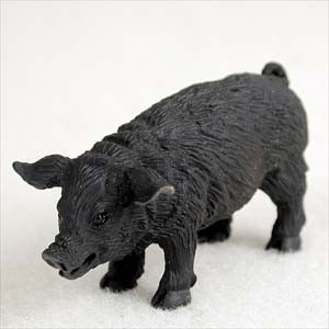 A small, detailed black pig figurine designed as a bonsai tree accessory. The miniature pig has a realistic, textured surface to represent coarse hair, floppy ears, a snout, and a small curled tail. It is captured in a standing pose on a plain white surface, ready to be used as a charming decorative accent in a bonsai display or miniature garden landscape.