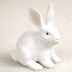 Miniature white rabbit figurine sitting upright, a decorative bonsai accessory