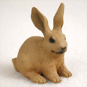 Miniature tan brown rabbit figurine sitting alert with long upright ears