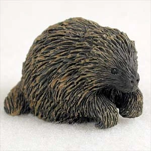 Miniature porcupine figurine with dense dark brown and black quills