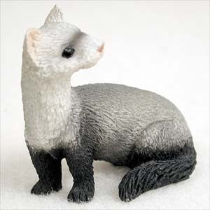 Miniature ferret figurine in a low standing pose with its head turned