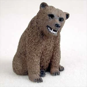 Miniature brown grizzly bear figurine in a seated pose, a bonsai accessory