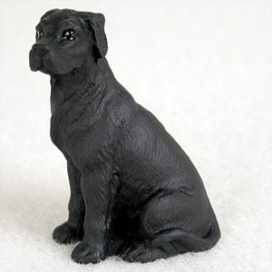 A small, detailed figurine of a black Great Dane sitting in a patient, upright position and looking off to the left. The dog features the breed's characteristic uncropped, floppy ears and a sleek, solid black coat with a subtle sheen that highlights its muscular frame and textured fur details. This miniature canine statue is designed as an ornament for bonsai trees or terrariums, captured here against a neutral, light-colored background.