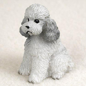 Miniature gray poodle figurine with a sport cut, sitting upright