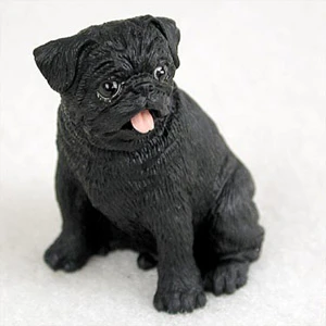 Miniature black pug figurine sitting upright and alert, a bonsai accessory