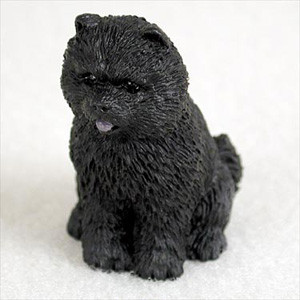 A detailed miniature figurine of a black Chow Chow dog, designed as a charming accessory for bonsai tree displays or fairy gardens. The figurine captures the breed's iconic stocky build and dense, textured black fur with realistic detail. Sitting in a classic pose, the black Chow Chow has small, rounded ears, dark eyes, and a slightly open mouth showing a tiny hint of its tongue. This decorative figurine is shown against a neutral, off-white background, highlighting its intricate craftsmanship and suitability for enhancing the aesthetics of a miniature landscape.