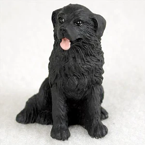 Miniature black Newfoundland figurine with the breed's thick wavy coat