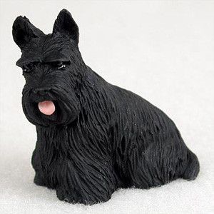 A detailed miniature figurine of a black Scottish Terrier (Scottie) designed as a decorative accessory for a bonsai tree landscape. The small statue captures the breed's characteristic features, including a textured, wire-haired coat, upright pointy ears, and a bearded face with prominent bushy eyebrows. 

The Scottie dog is shown in a sitting position, looking slightly to the side with its small pink tongue peeking out playfully. Its dark, lifelike eyes add personality to the piece. Set against a clean, neutral background, the figurine is crafted to serve as a charming accent for indoor gardens, miniature dioramas, or as a companion to a bonsai display.
