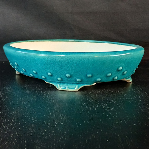12 inch oval Yixing pot in turquoise with a riveted bead design
