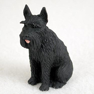 A detailed miniature figurine of a Giant Black Schnauzer, designed as a decorative accessory for a bonsai tree or miniature garden. The dog is depicted in a sitting pose, showcasing realistic details such as textured, wiry black fur, pointed ears, and the breed's signature bushy eyebrows and long beard. A small, vibrant pink tongue peeks out from its muzzle, adding a lifelike and playful touch. The entire figurine is shown against a clean, neutral white background, emphasizing its intricate craftsmanship.