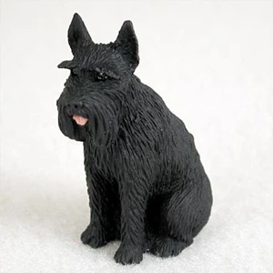 Miniature black Giant Schnauzer figurine in a sitting pose, a bonsai accessory