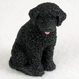Miniature solid black Portuguese Water Dog figurine, a bonsai accessory