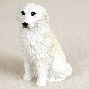 Miniature Great Pyrenees figurine in a classic seated pose, a bonsai accessory