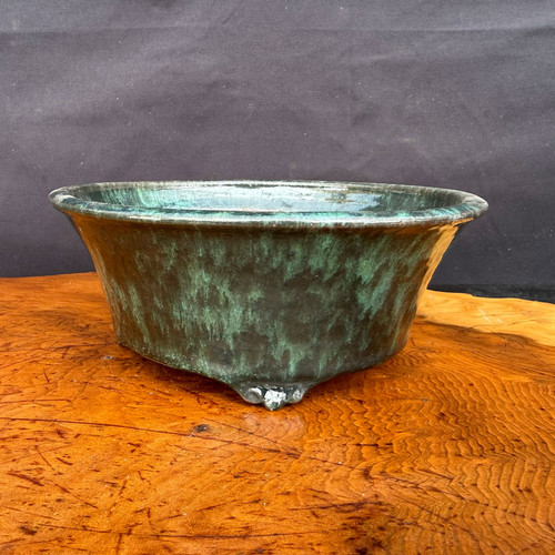 7.25 inch Shuho handmade round flared bonsai pot in a dark green glaze