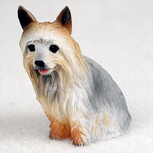 Miniature Silky Terrier figurine sitting upright with a long silky coat