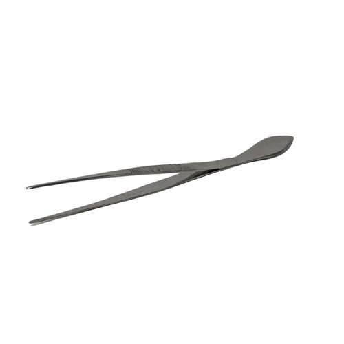 A high-quality Japanese bonsai needle tweezer spatula tool, displayed in a three-quarter perspective against a plain white background. One end of the tool features two long, thin, and precisely tapered needle-nose tweezer arms, spread open. The mid-section of these arms is textured with horizontal serrations for an improved grip. The other end of the tool is a flat, teardrop-shaped spatula, designed for meticulous soil work or smoothing. The tool is made from a dark, matte-finished metal, embodying traditional Japanese tool design. A soft shadow falls beneath the tool, highlighting its slender and elegant construction.